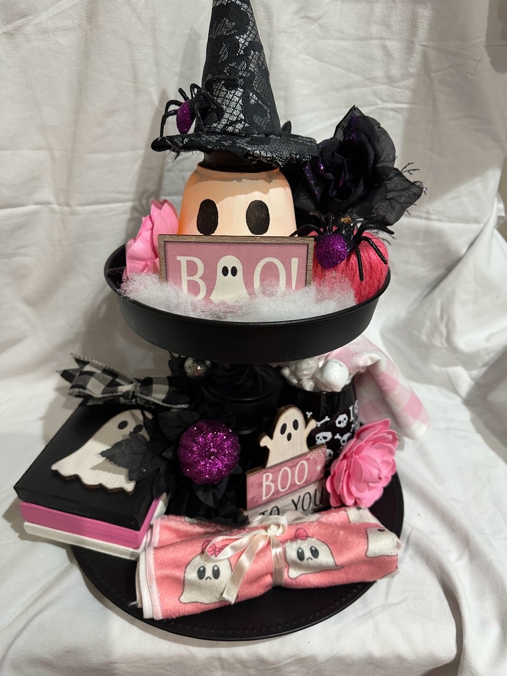 A 2-tier tray featuring 12 Halloween decorations, Every piece is handcrafted